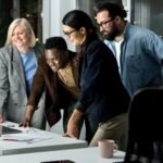 Team working on most profitable businesses tech startup in a modern office environment